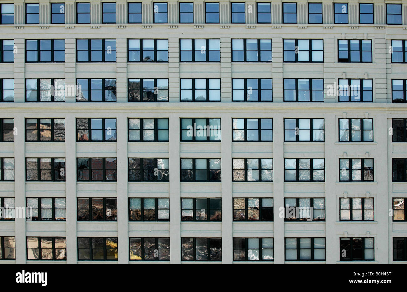 rows of square office building windows filling the frame in a symmetrical  image Stock Photo - Alamy