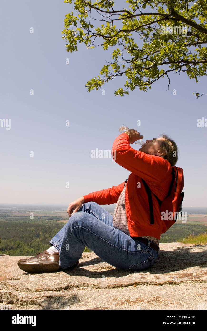 Wearing red top and blue jeans hi-res stock photography and images - Alamy