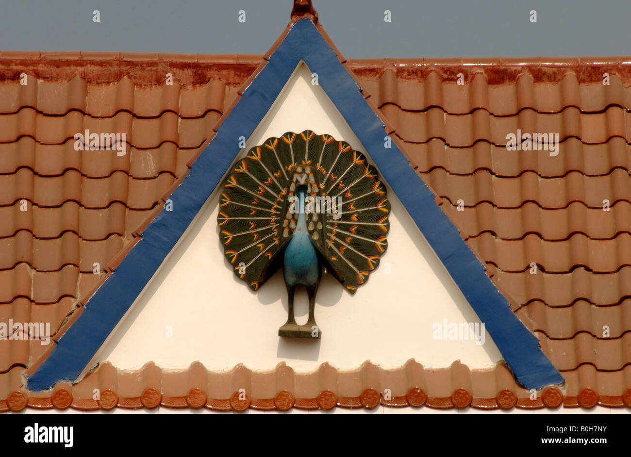 Peacock motif on eave of Dai house south Yunnan China Stock Photo