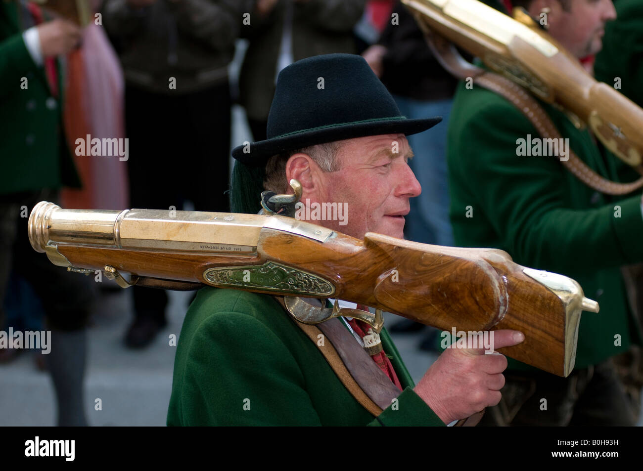 Man wearing traditional costume carrying a large rifle over his shoulder, Zillertaler Gauderfest festival, Tyrol, Austria, Euro Stock Photo