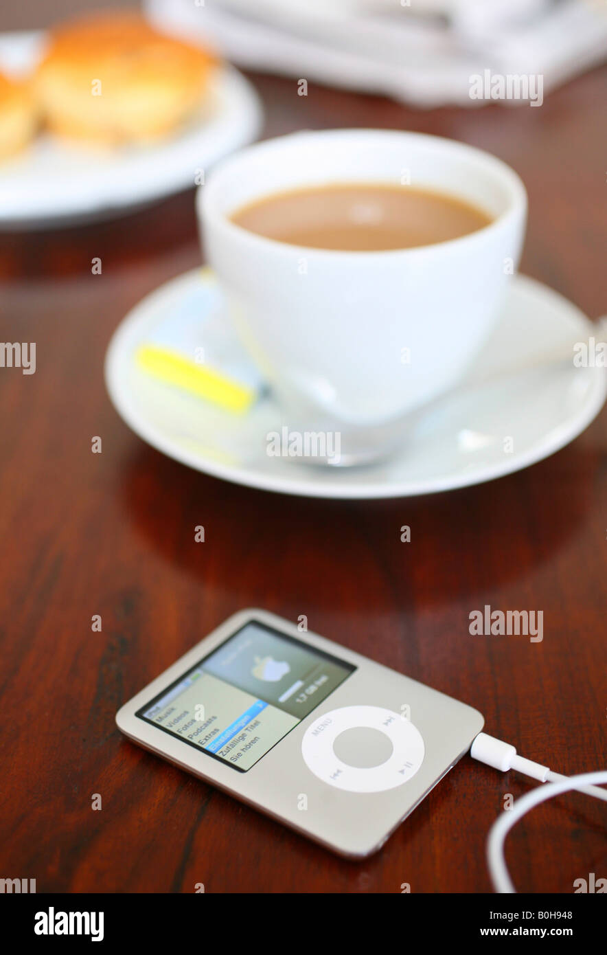 Apple iPod Nano laying on a coffee table Stock Photo