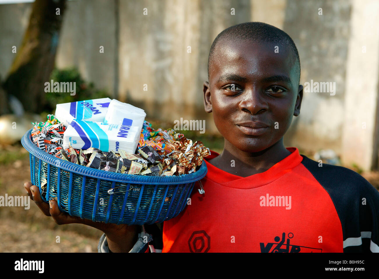Teenage boy selling sweets and paper tissues in Douala, Cameroon, Africa Stock Photo