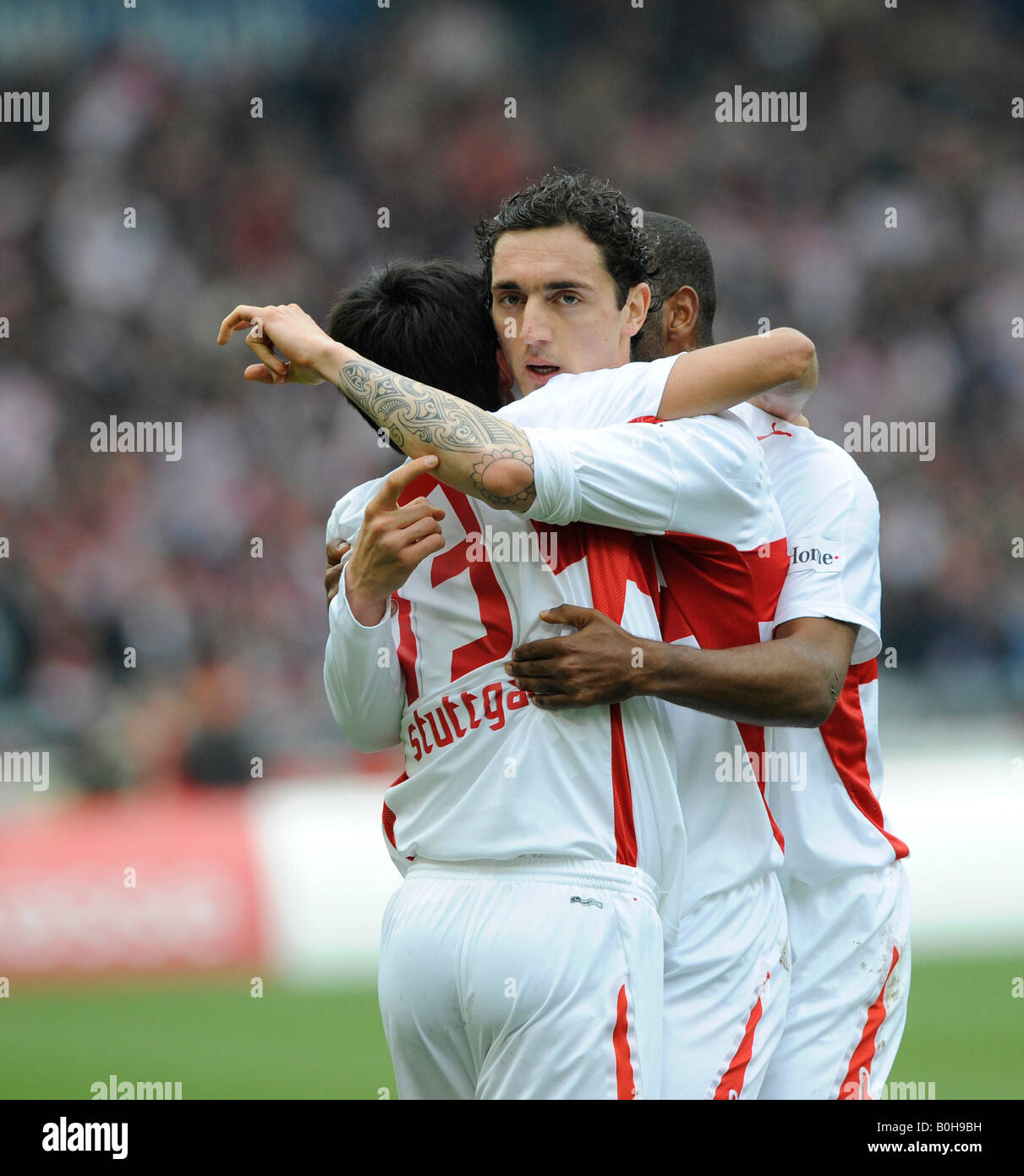 VfB Stuttgart football club players celebrating a goal, left to right ...