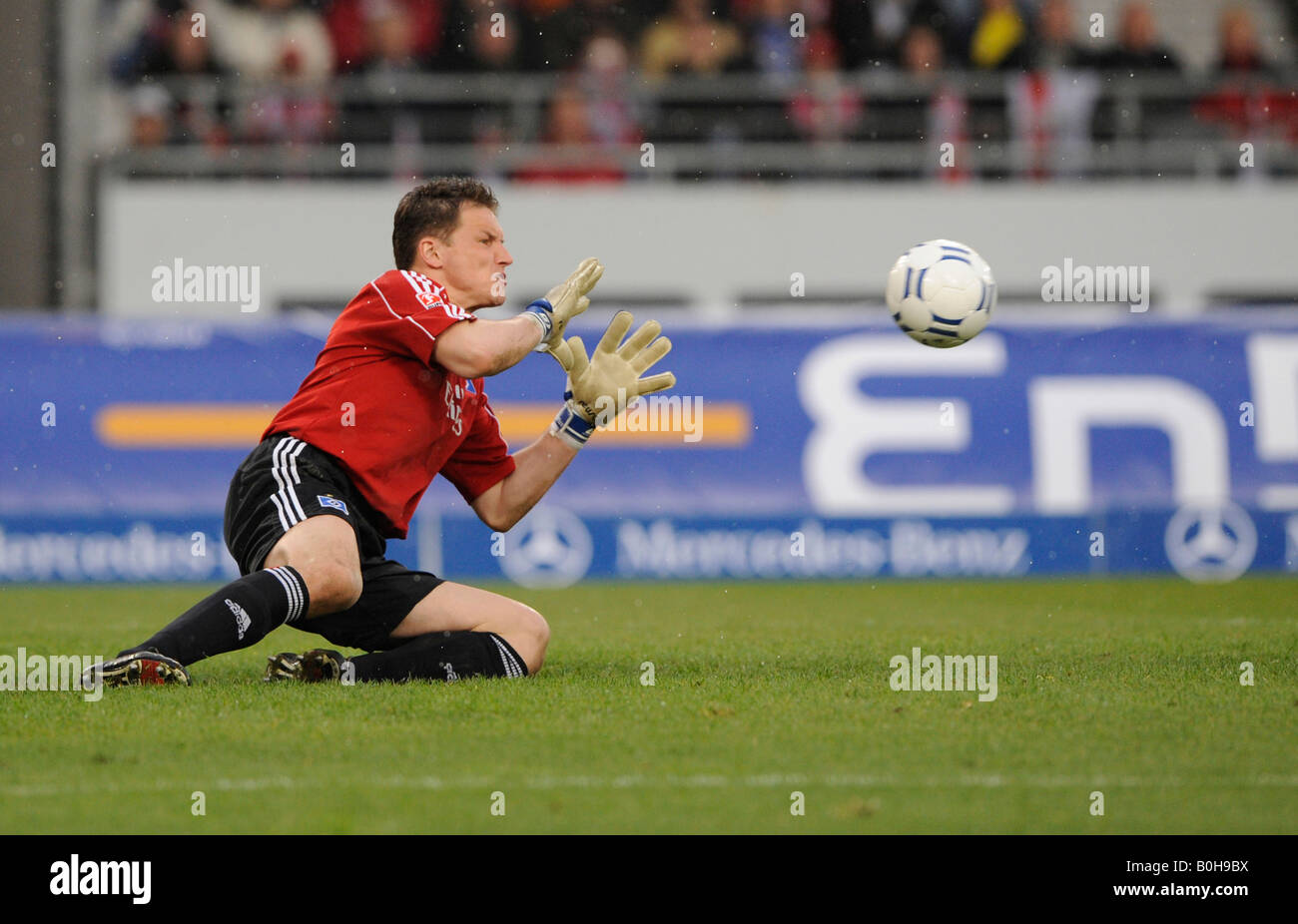 Goalkeeper Timo Rost fending off shot on goal, Hamburger SV football club Stock Photo