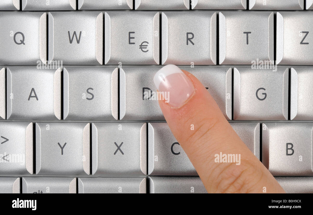 Apple Mac Book Pro keyboard, laptop, finger pointing at the Euro symbol  Stock Photo - Alamy