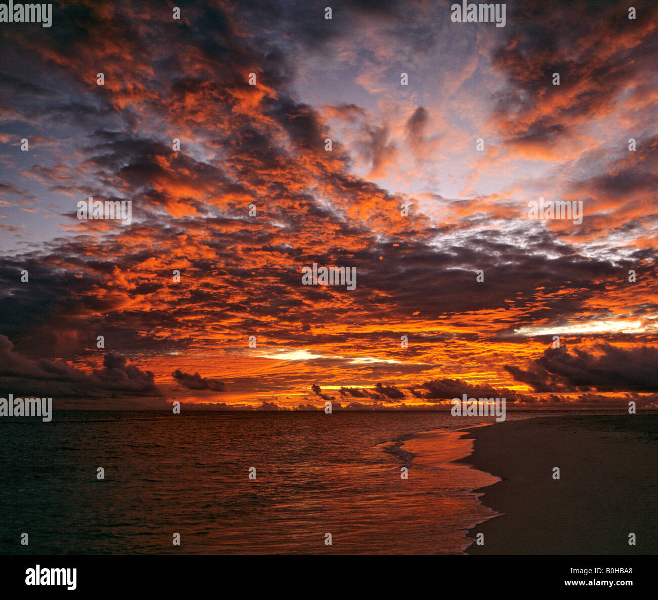 Beautiful sunset over a beach, Maldives, Indian Ocean Stock Photo