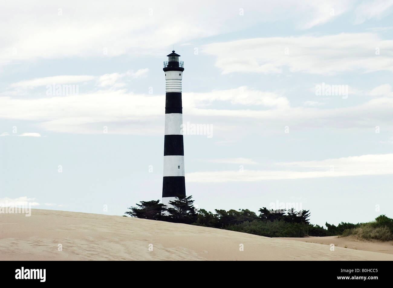Tall black-and-white striped lighthouse at Faro Querandi near Villa Gesell, Reserva dunicola Municipal Faro Querandi, Buenos Ai Stock Photo