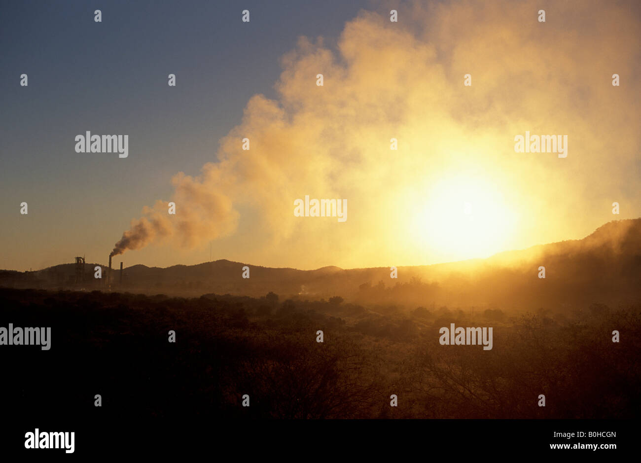 Smoke rising from smokestacks at a cement factory near Los Mochis, Sinaloa, Mexico Stock Photo