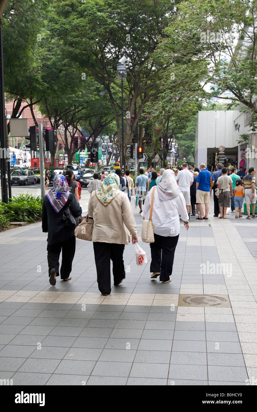 Muslim women walking along Orchard Road in Singapore, Southeast Asia Stock Photo