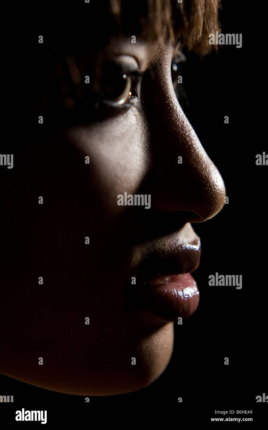 Profile of a young, dark-skinned woman, face Stock Photo