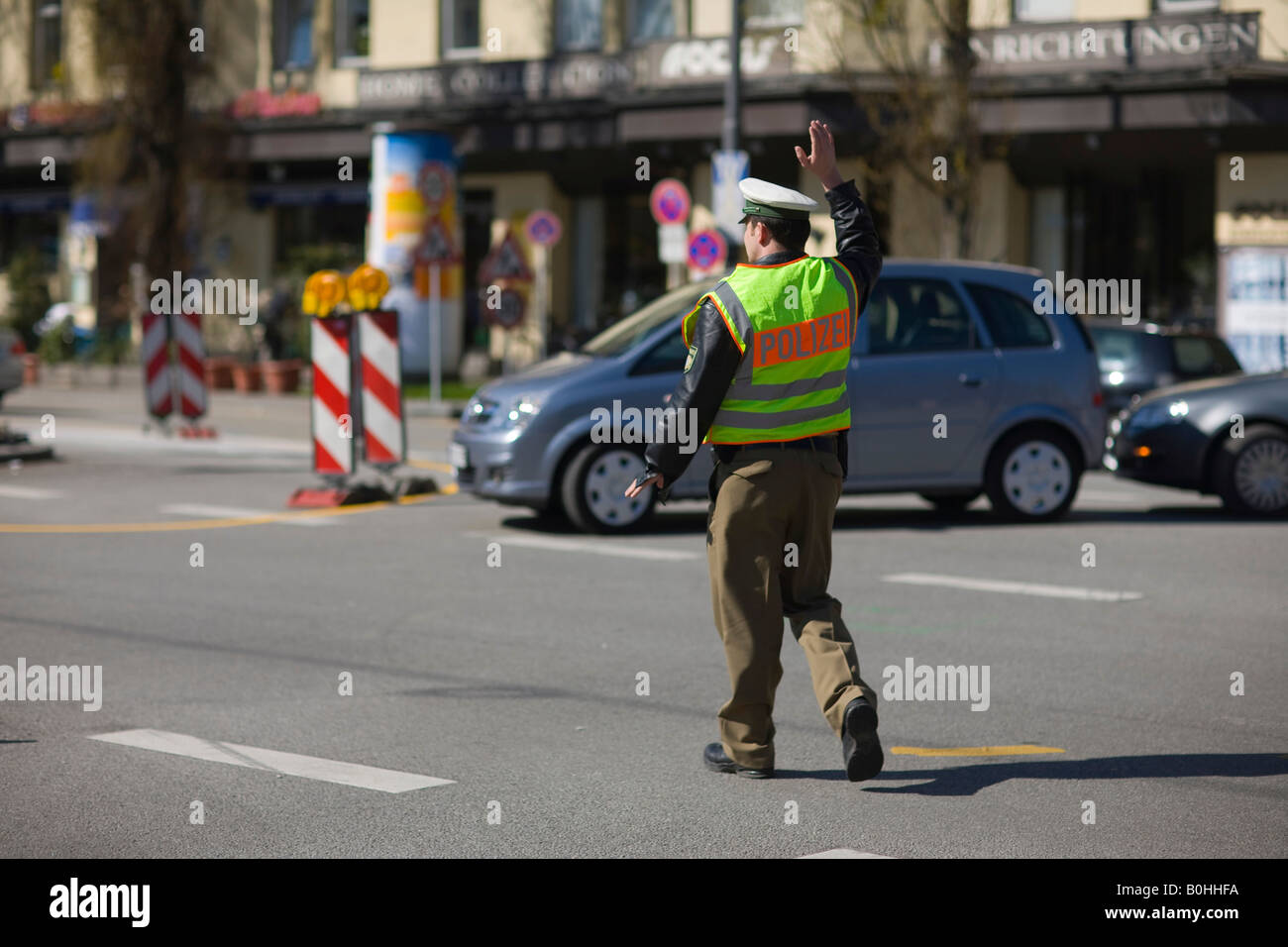 Policeman, police officer directing traffic, Munich, Bavaria, Germany Stock Photo