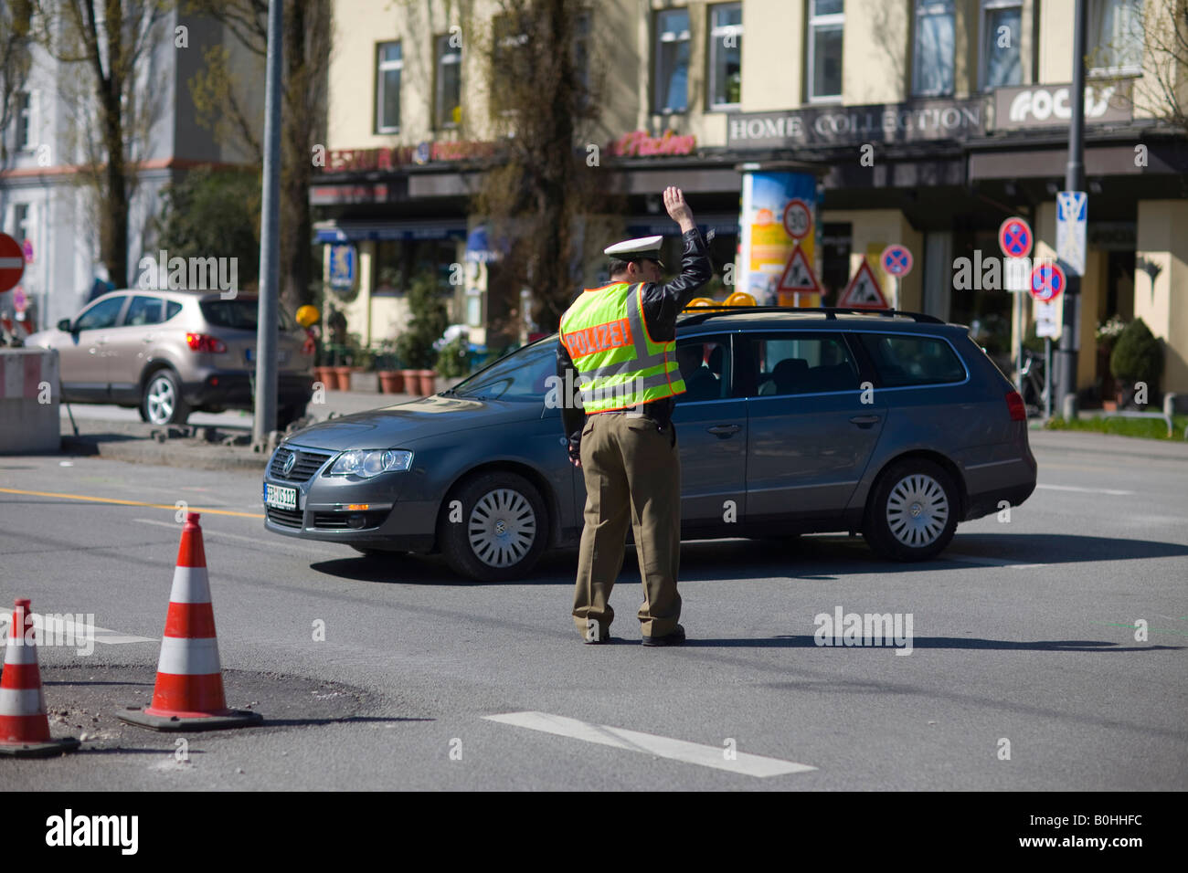 Policeman, police officer directing traffic, Munich, Bavaria, Germany Stock Photo