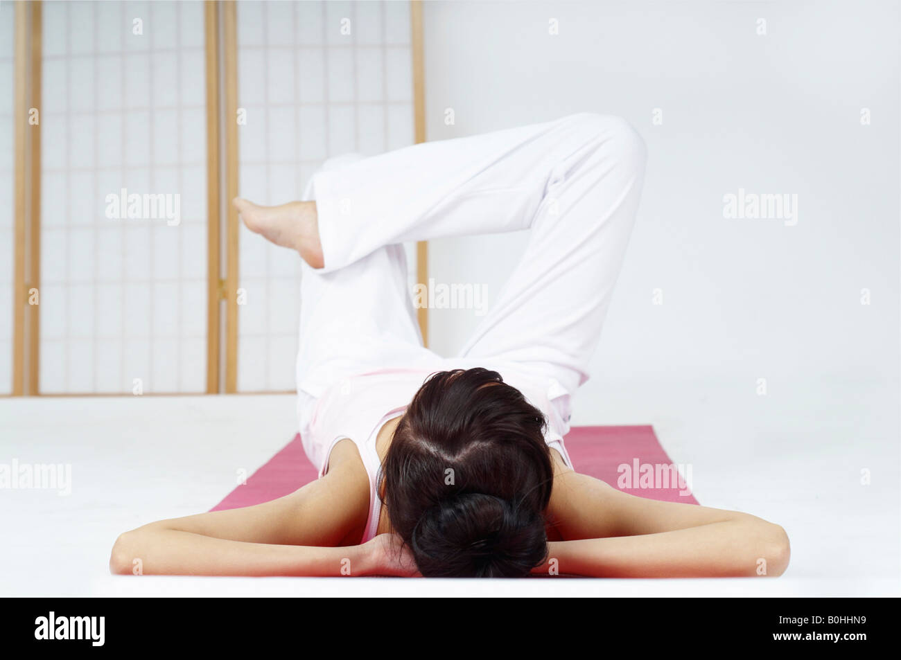 Young woman relaxing and meditating Stock Photo