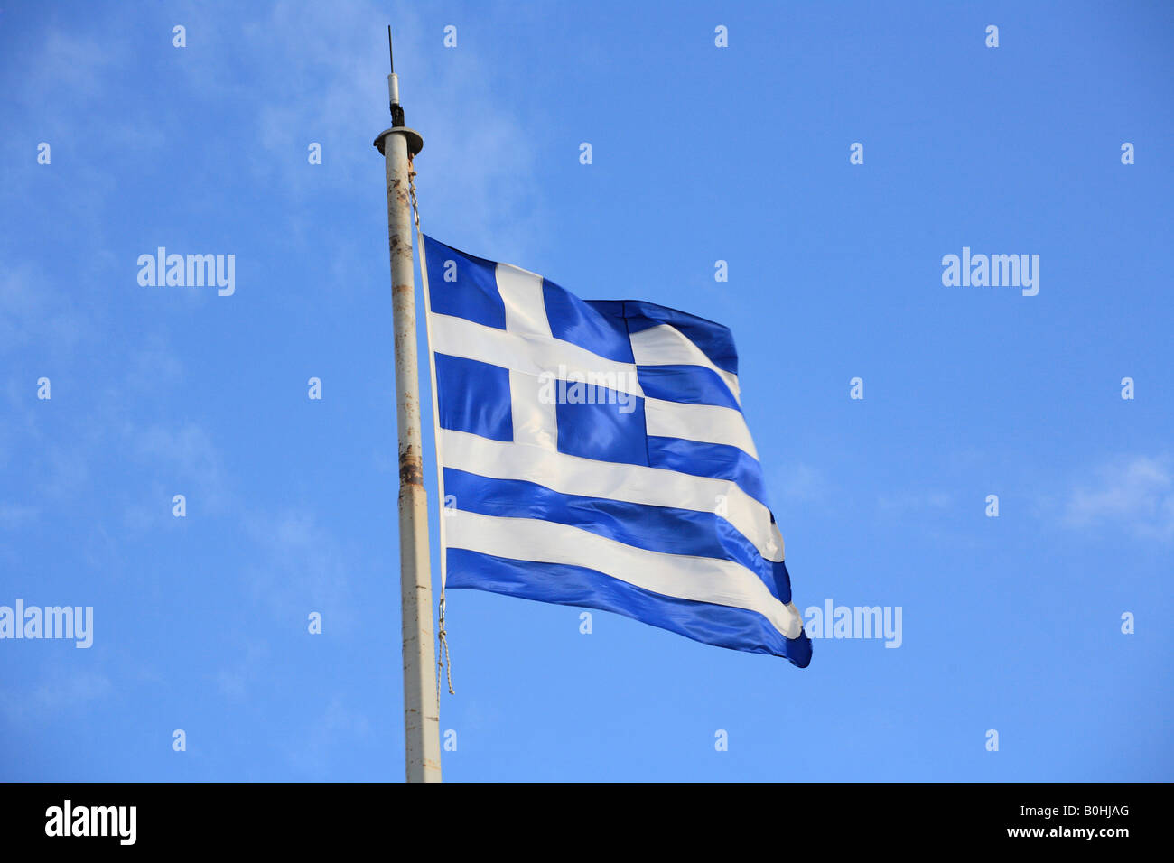 Greek flag against a blue sky Stock Photo
