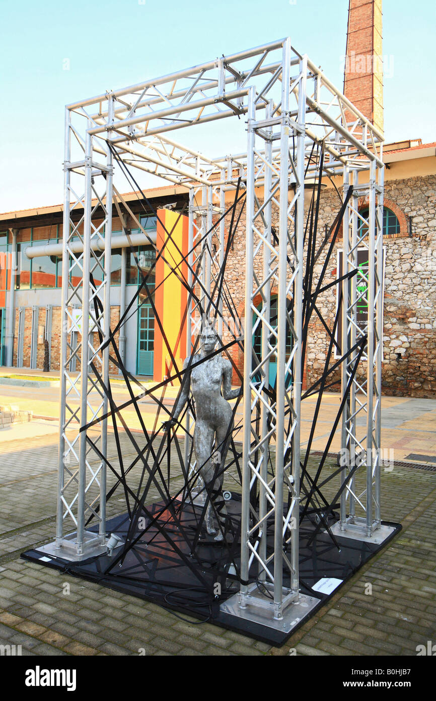 Free standing outdoor art installation, sculpture of a naked woman inside a  metal scaffolding frame at the Gazi Factory in Athe Stock Photo - Alamy