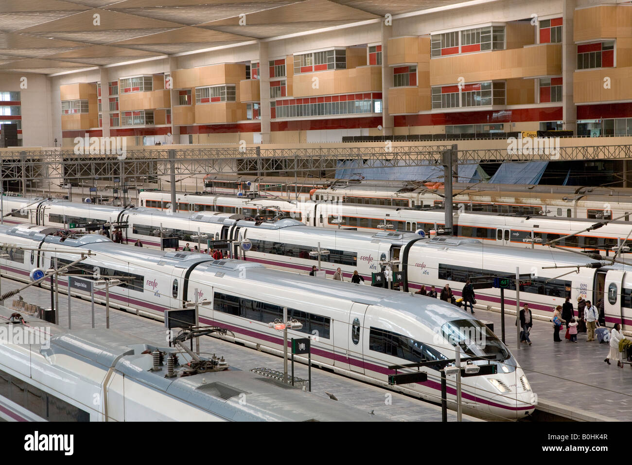 AVE high-speed bullet trains waiting at the platforms of the Estacion de Delicias train station in Saragossa or Zaragoza, Casti Stock Photo