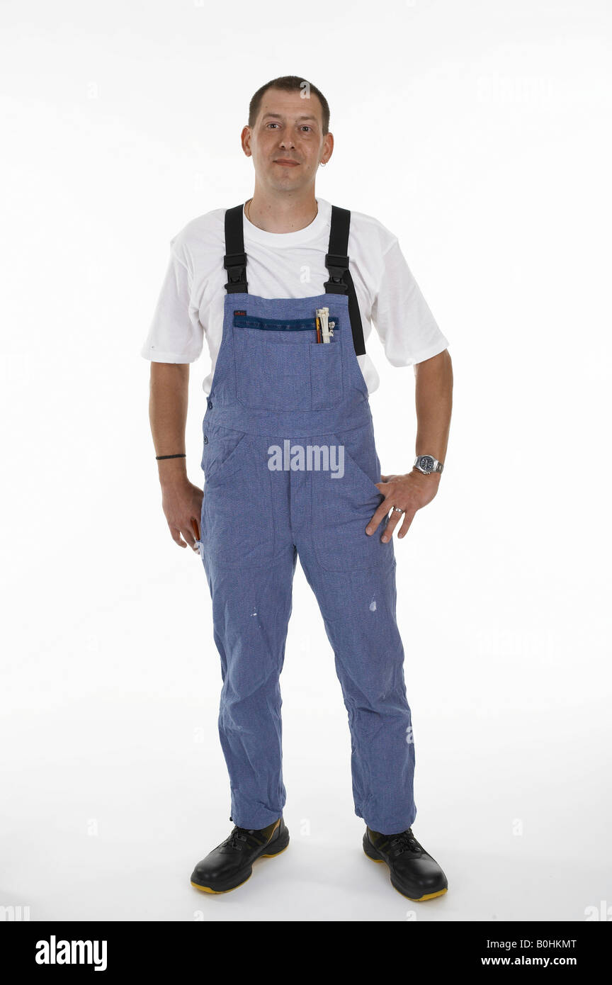 Workman wearing overalls and safety boots Stock Photo