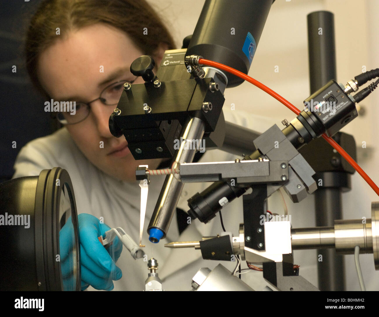 A post grad Oxford student sets up a physics experiment Stock Photo
