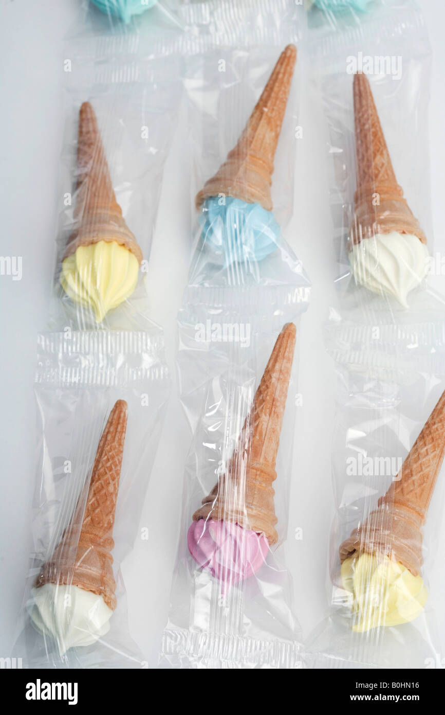 Marshmallow waffles in the shape of soft serve ice-creams in various colours Stock Photo