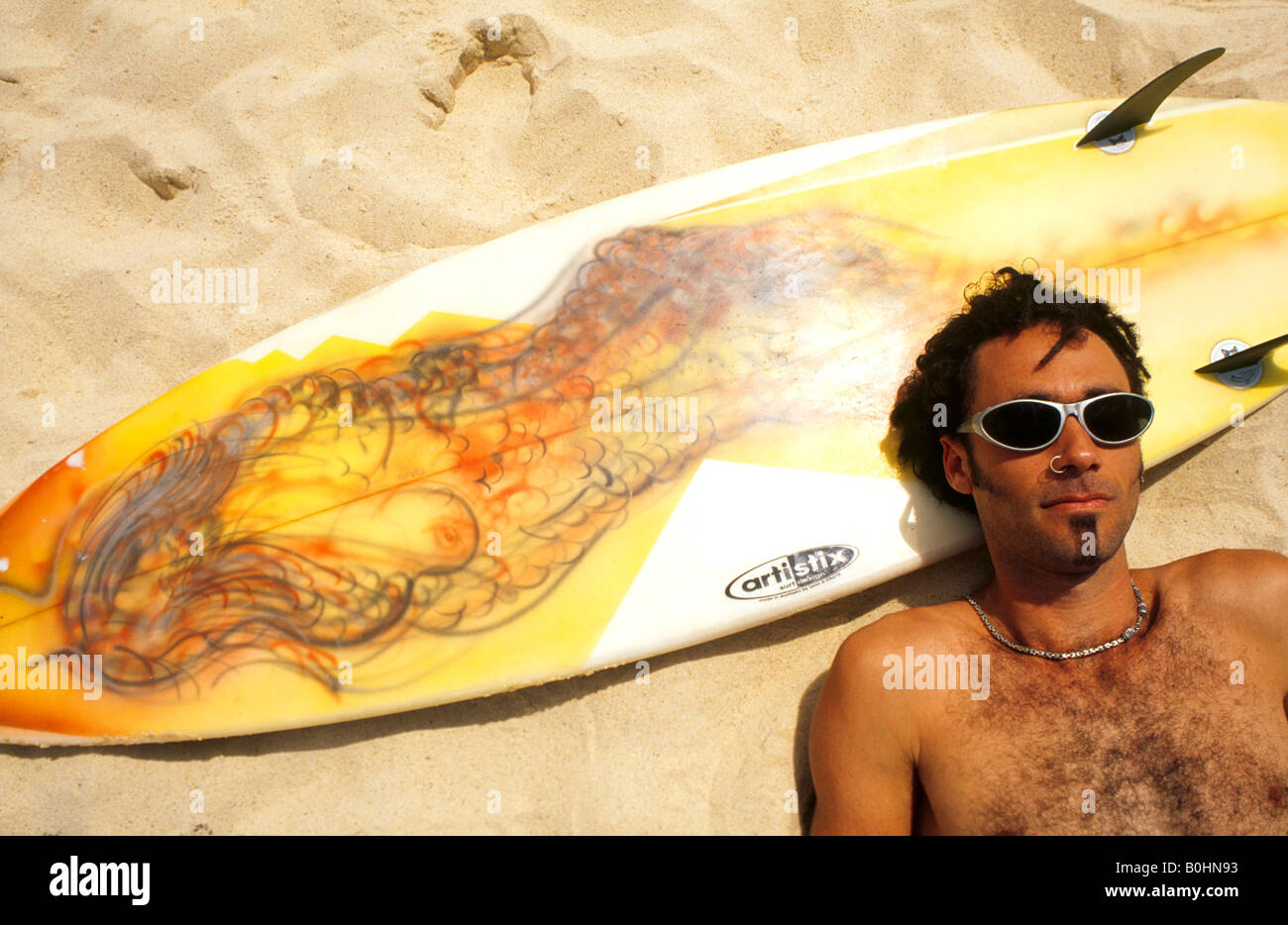 A surfer relaxing on his board on Bondai Beach, Sydney, Australia. Stock Photo