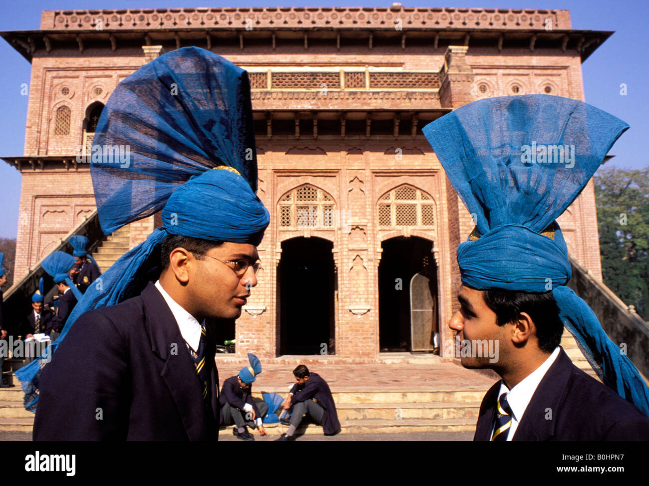 Two male students wearing the traditional school uniform at Aitchison