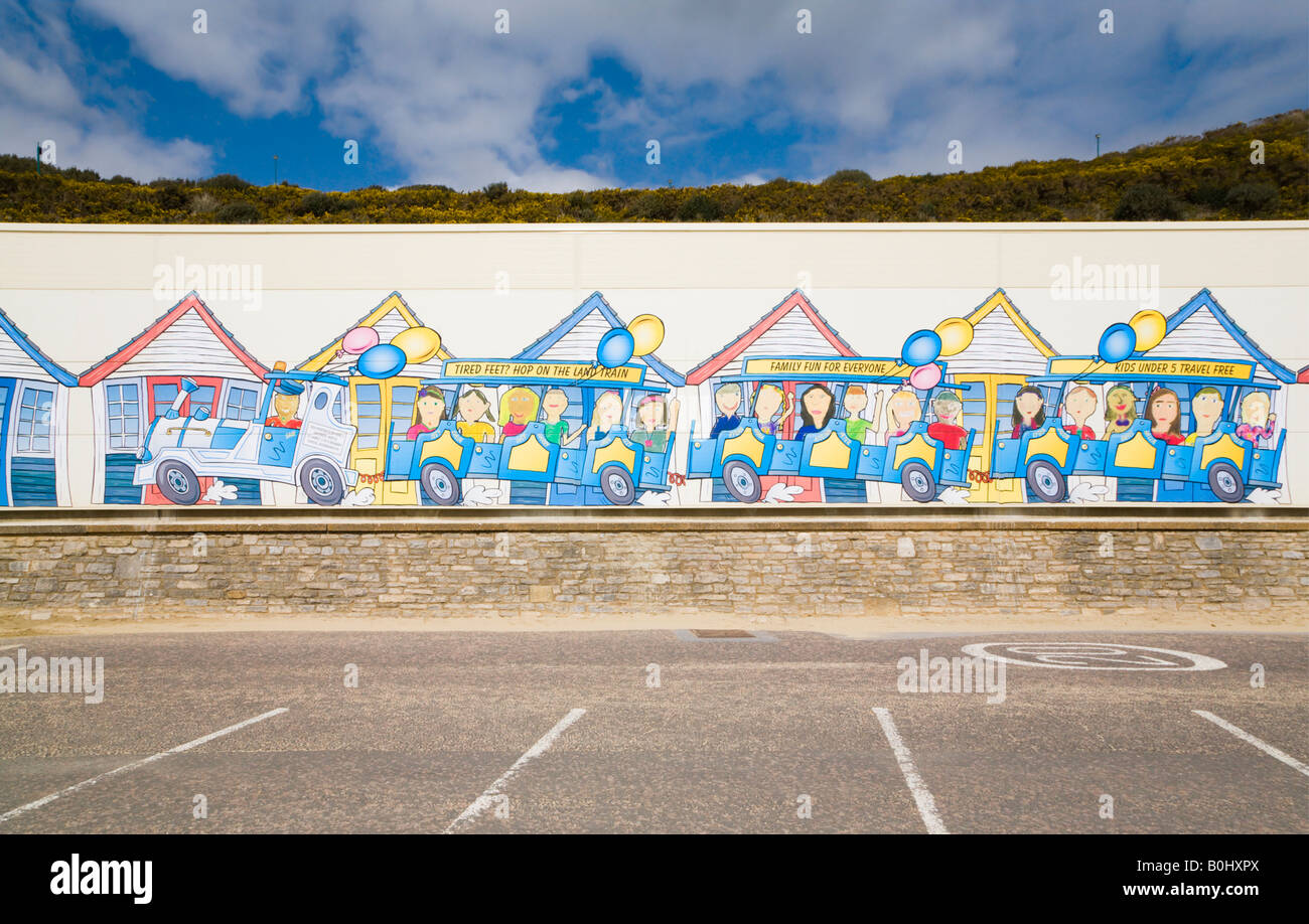 The shed housing the Bournemouth seafront land trains with mural of a train painted by artist Lisa Berkshire. Dorset, UK. Stock Photo