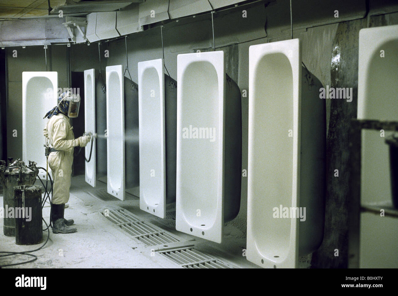 Spraying Enamel on to Baths Stock Photo Alamy