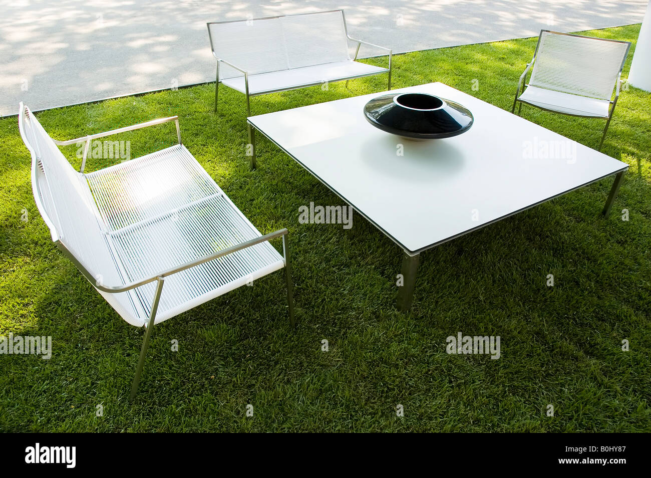 White modern garden furniture on grass Stock Photo Alamy