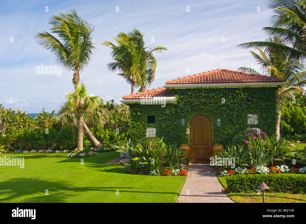 A vine covered house on the beach at Palm Beach Florida USA Stock Photo