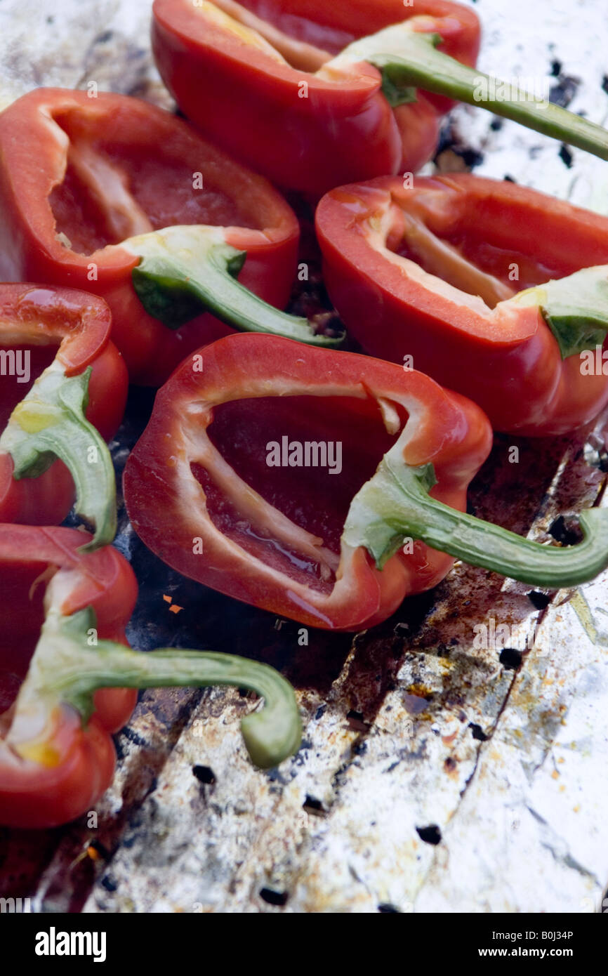 Red bell peppers cooking on the barbecue Stock Photo Alamy
