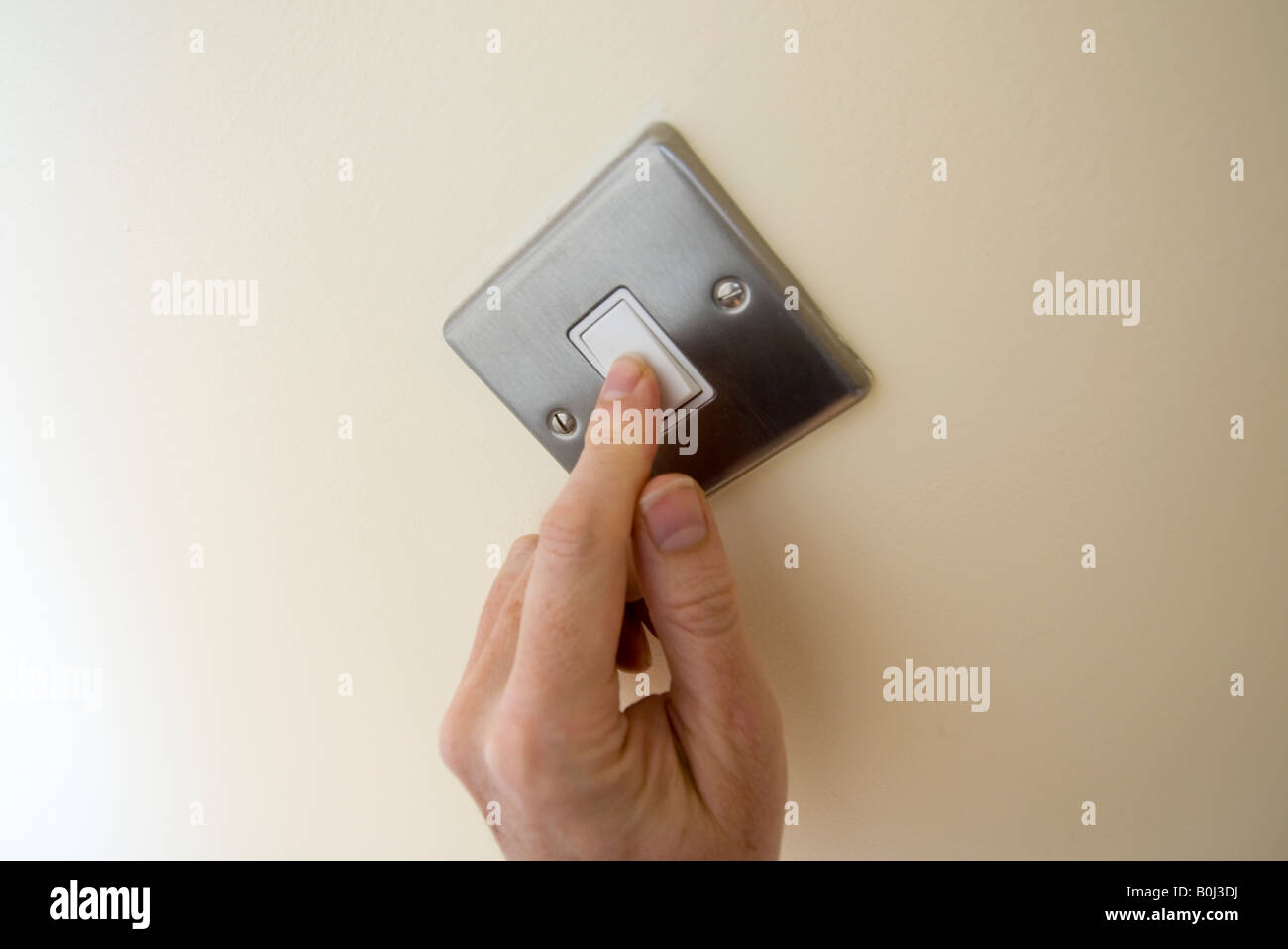 light switch being turned on Stock Photo Alamy