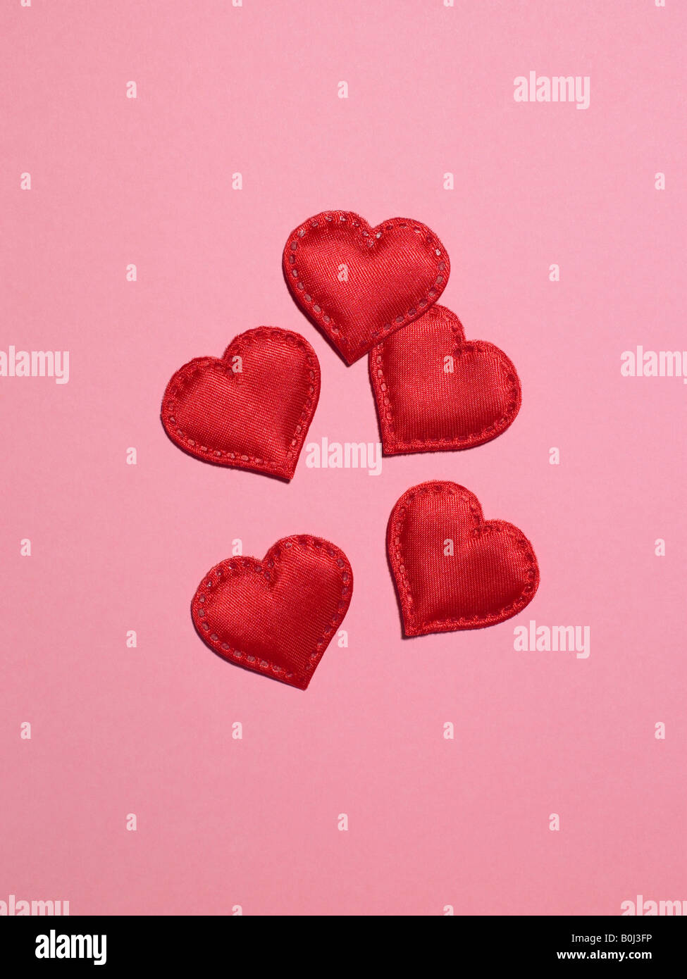 hearts on pink background Stock Photo