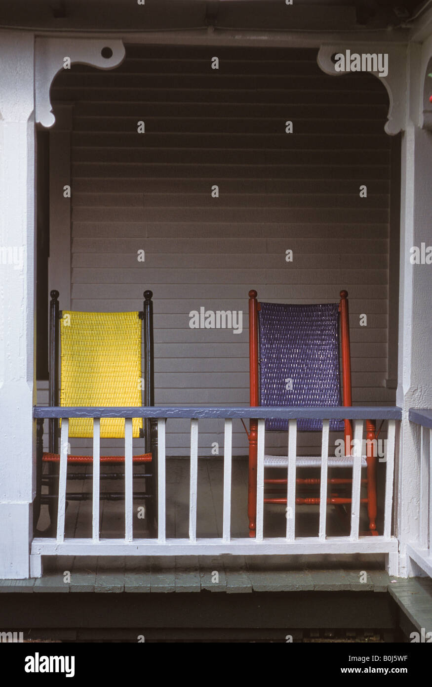 two colorful wicker rocking chairs on summer vacation house porch Stock ...