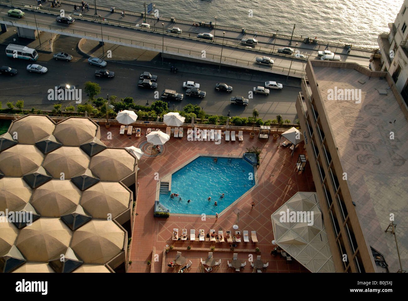 Tourists in the Ramses Hilton swimming pool by the River Nile Cairo