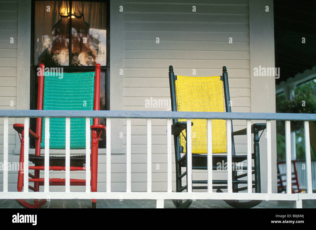 Yellow rocking chairs hi-res stock photography and images - Alamy