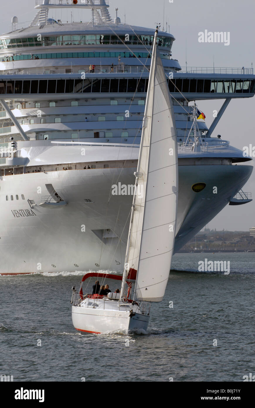 A sailing yacht is dwarfed by P&O cruise ship "Ventura" as she leaves