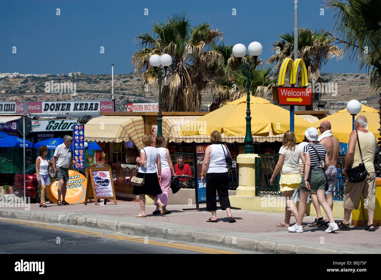 Tourists along the Seafront Bugibba Malta Stock Photo Alamy