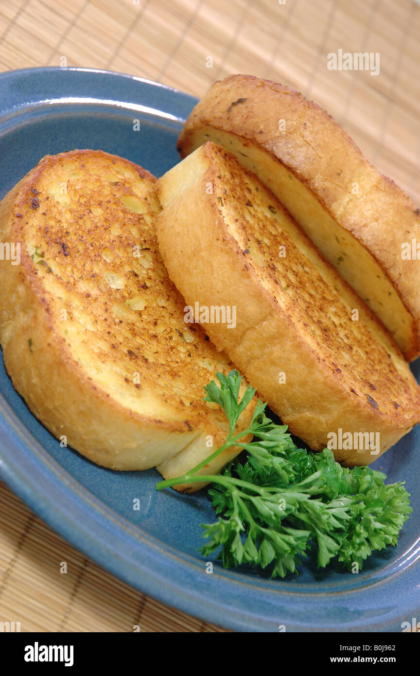 Three slices of Texas toast on a small blue ceramic plate Stock Photo