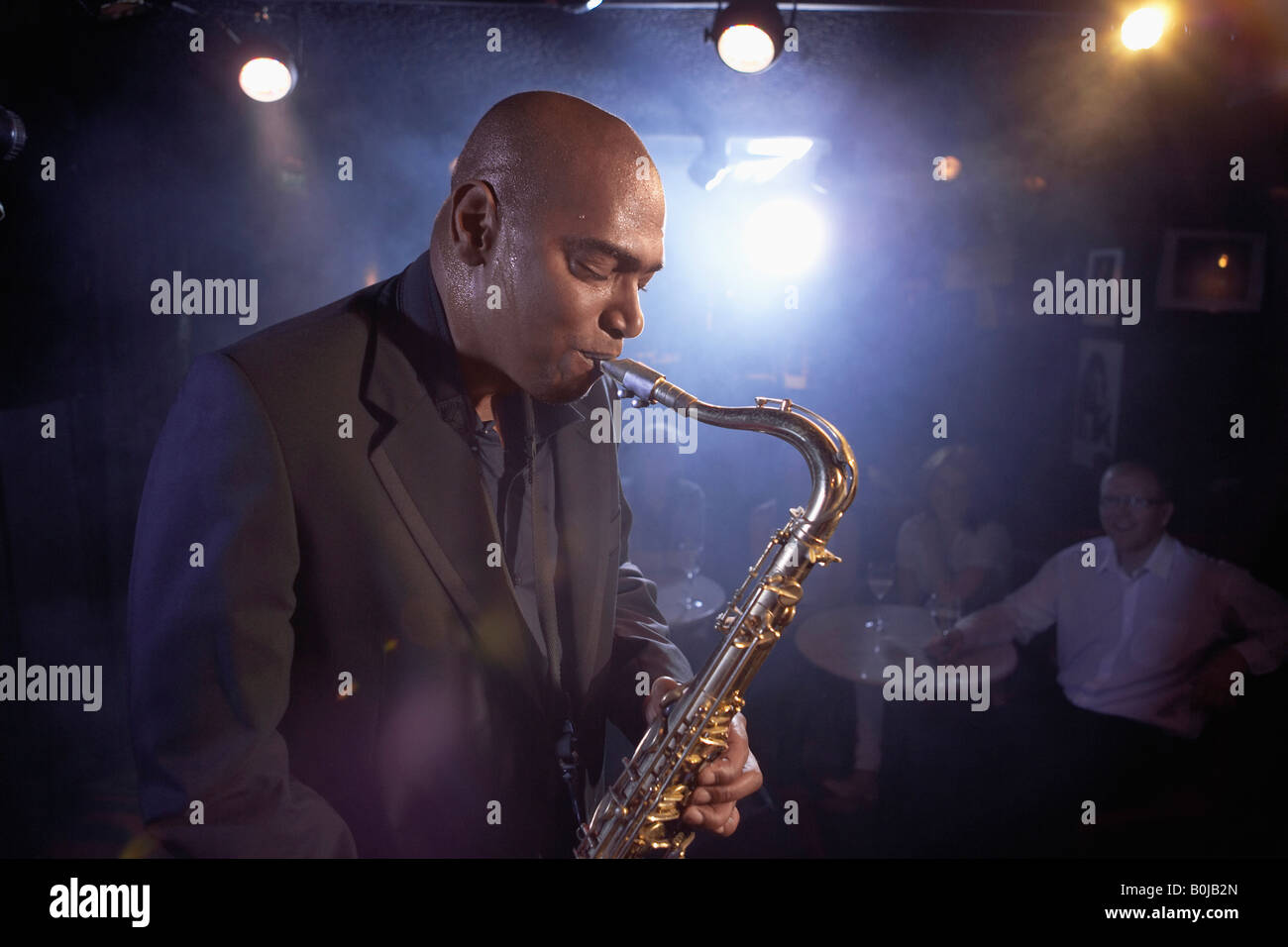 Saxophonist Performing in Jazz Club Stock Photo