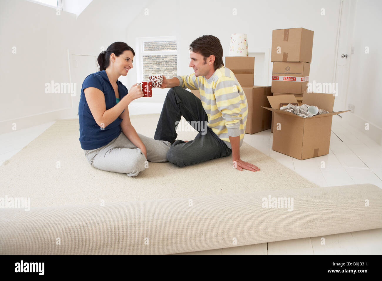 Couple Moving into New Home Stock Photo - Alamy