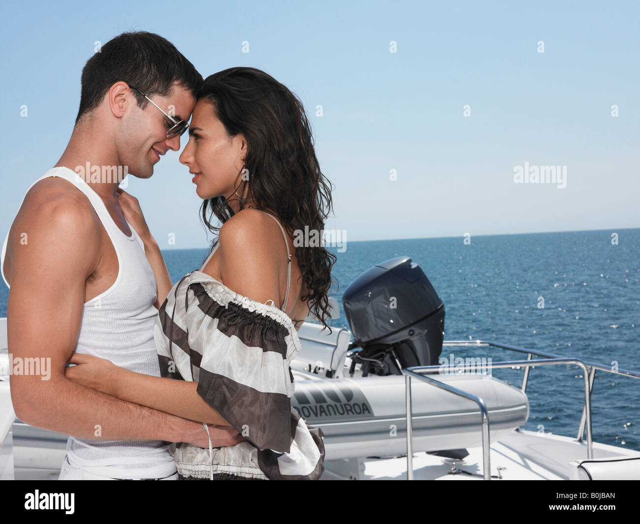 Young couple embracing on yacht, profile Stock Photohttps. www.alamy.com/st...