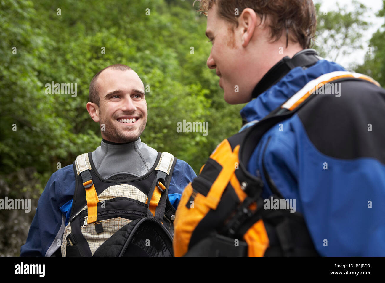 Two men wearing wetsuits, outdoors Stock Photo Alamy