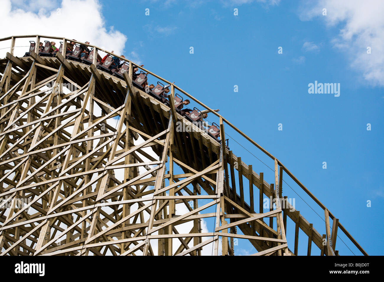 cart on wooden rollercoaster going downhill Stock Photo