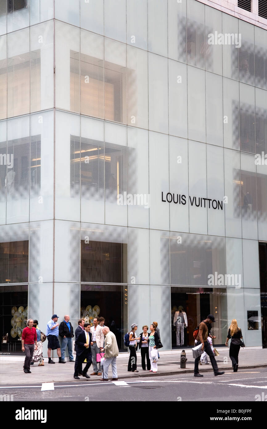 Pedestrians walking past the Louis Vuitton store on 5th avenue Stock Photo  - Alamy