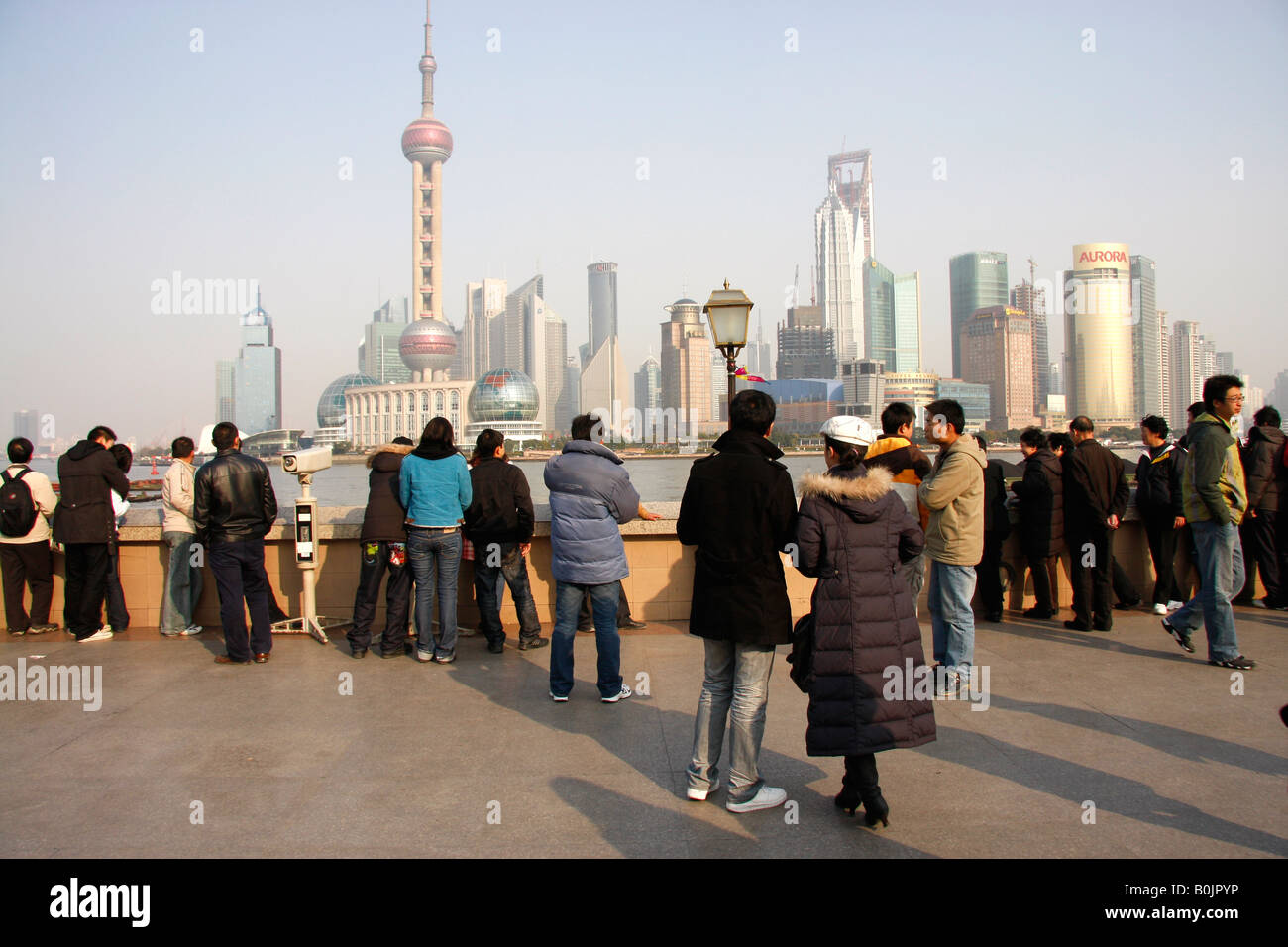 Chinese tourists and sightseers on the Bund in Shanghai.China Stock Photo