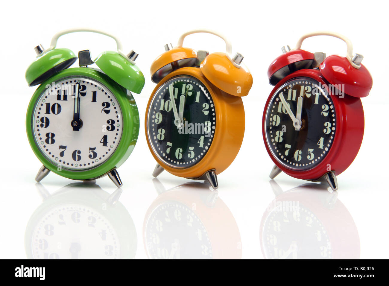 timing red yellow and green alarm clock untill twelve oclock closeup with nice reflection Stock