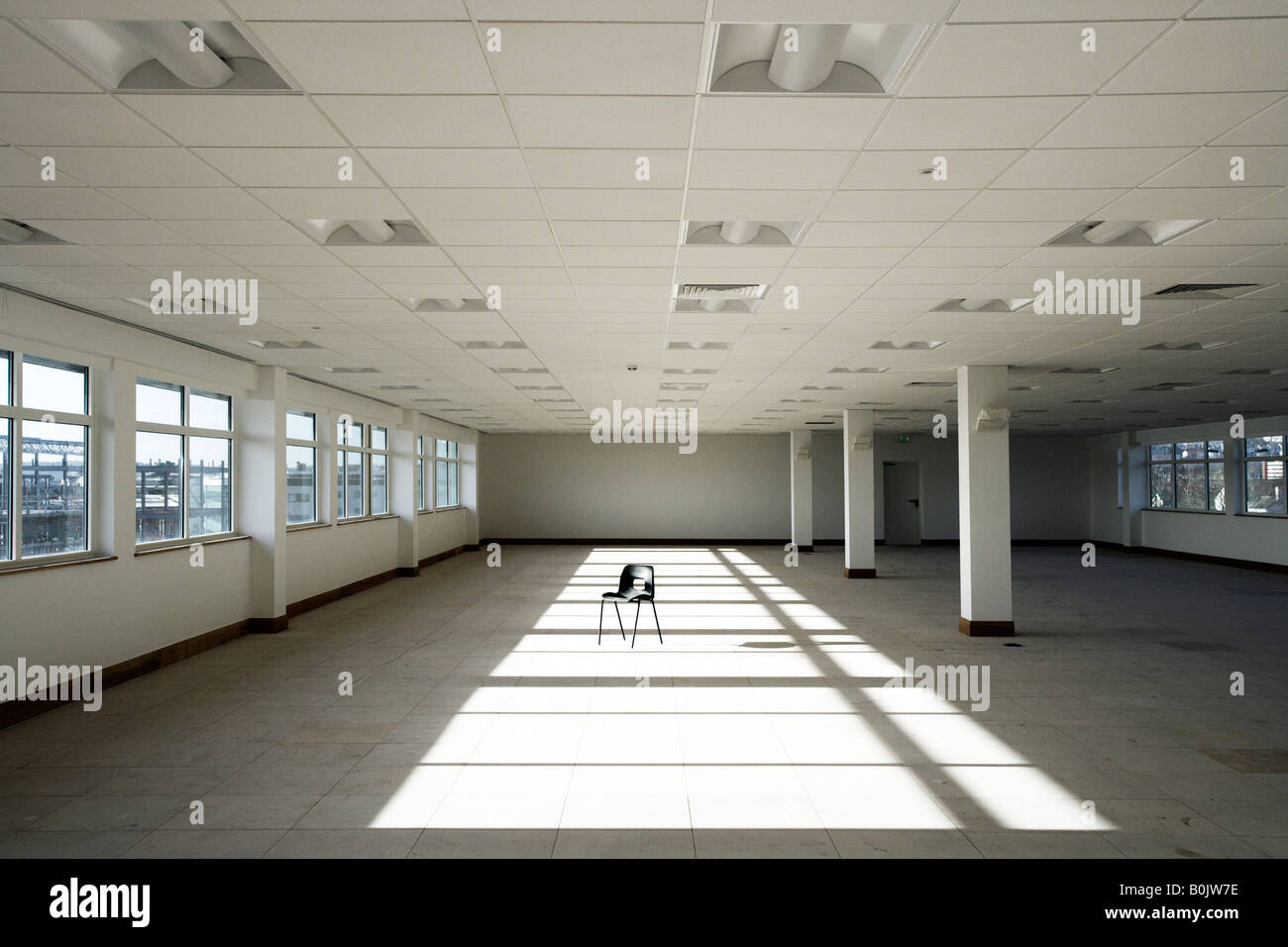 Vacant office with plastic chair in new office building Stock Photo Alamy