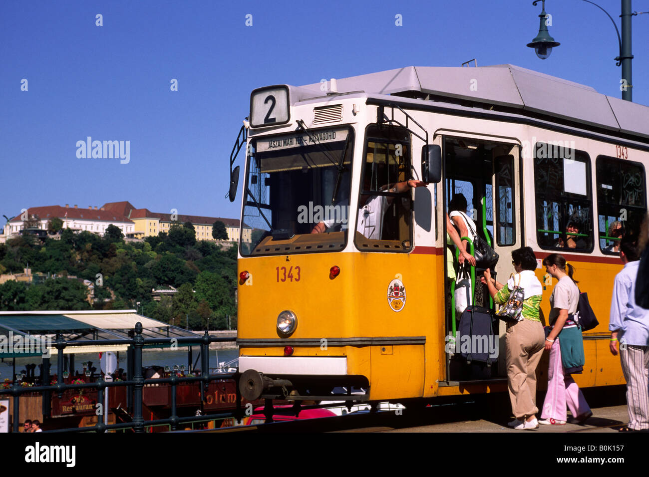 Hungary, Budapest, people boarding tram Stock Photo