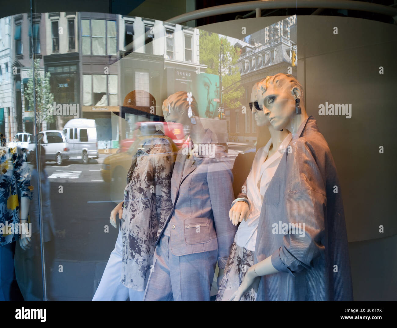 mannequin in a window dressed in trendy clothes on Madison Avenue in New York City Stock Photo