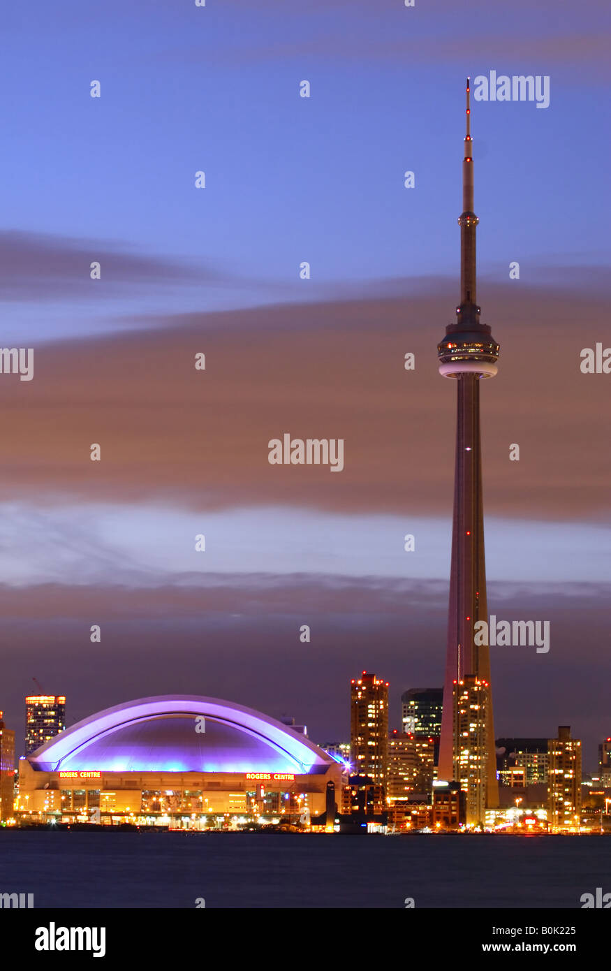 The CN Tower and Rogers Center in Toronto Ontario at night Stock Photo ...